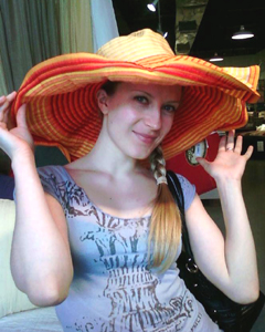 Olga wearing a big hat